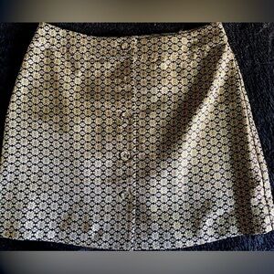 WAYF gold and black button-front daisy mini skirt
